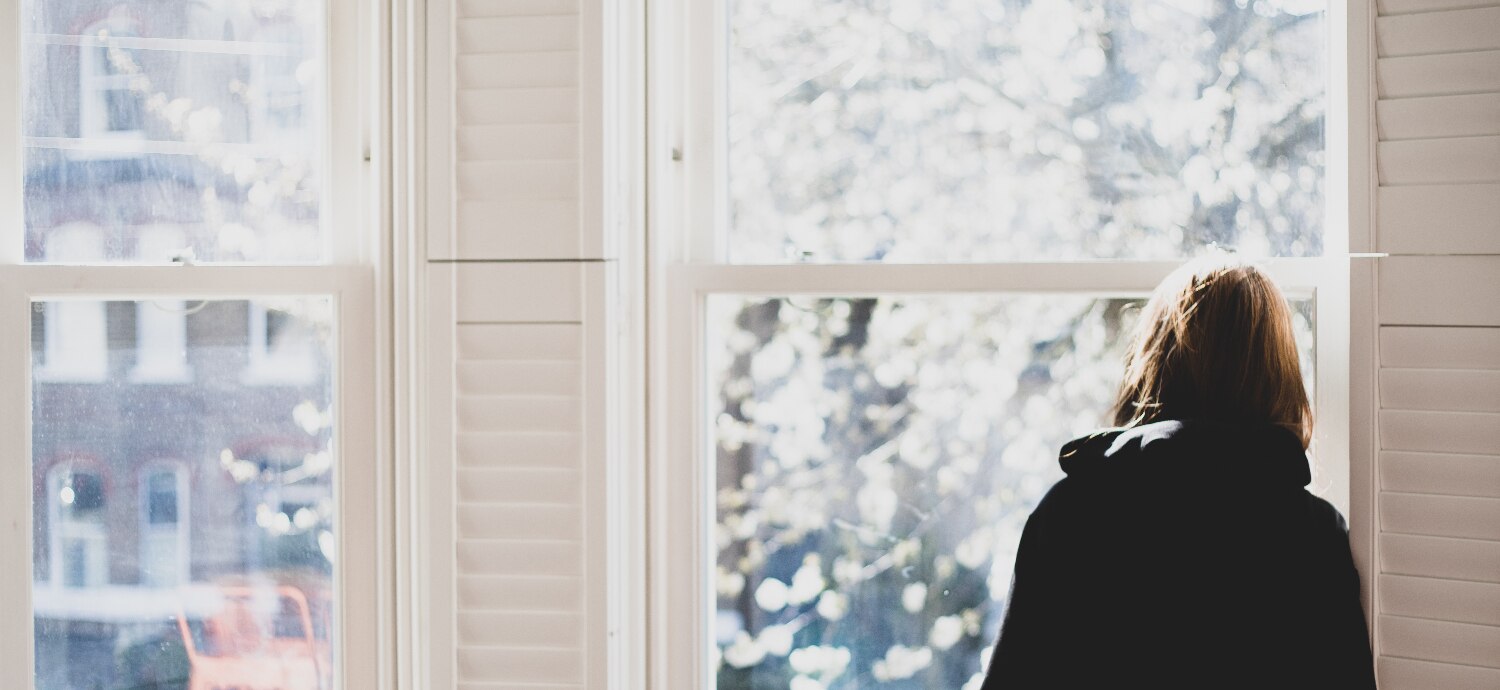 woman looking out of a window