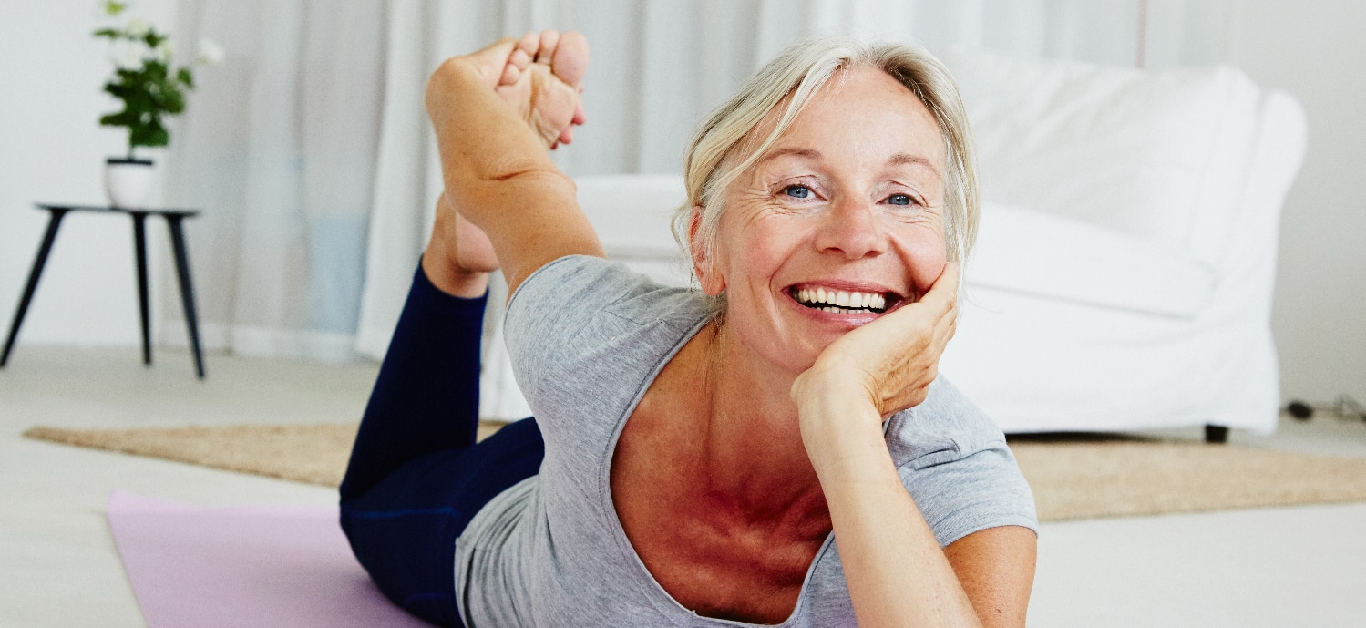 Woman doing yoga to support bone health for a lifetime