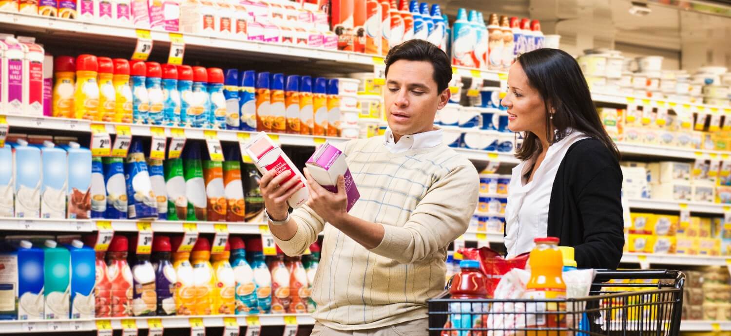 couple shopping in the juice aisle