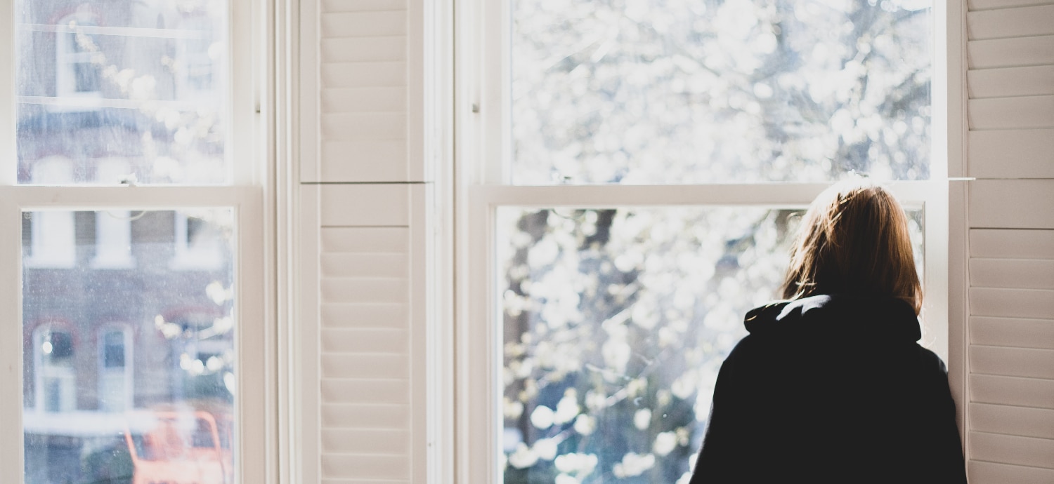 woman looking out of a window