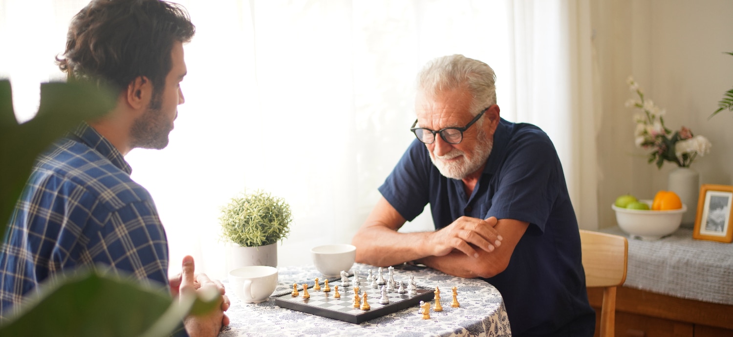 man playing chess with another man for brain health
