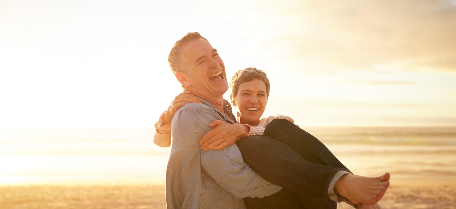 An energetic older couple on the beach energy