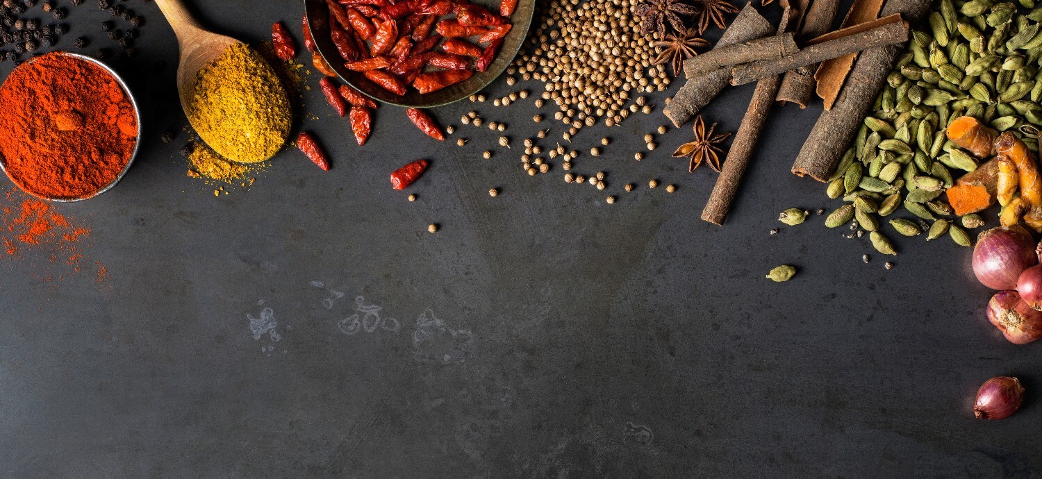 spices against a black background