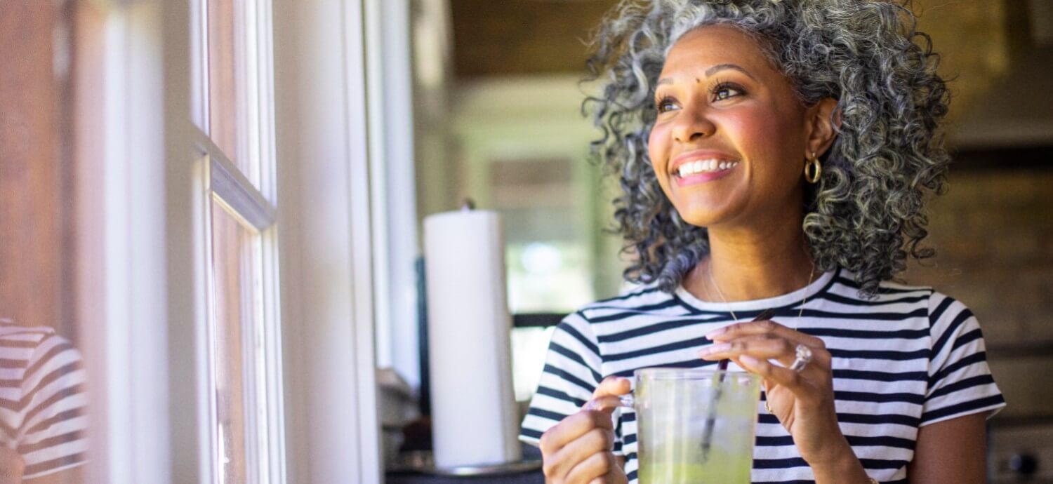 woman drinking green smoothie immune system health