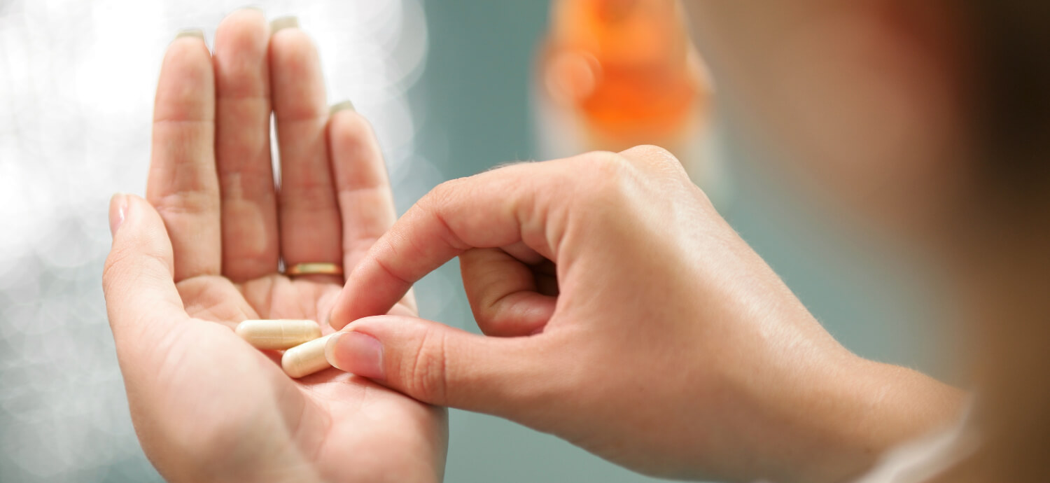 a woman taking calcium supplements for bone health