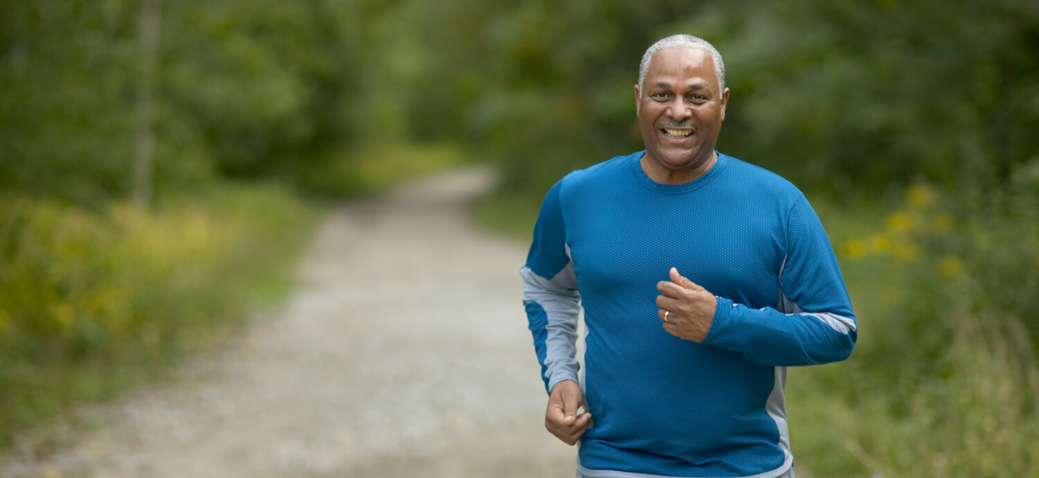 African American senior man running